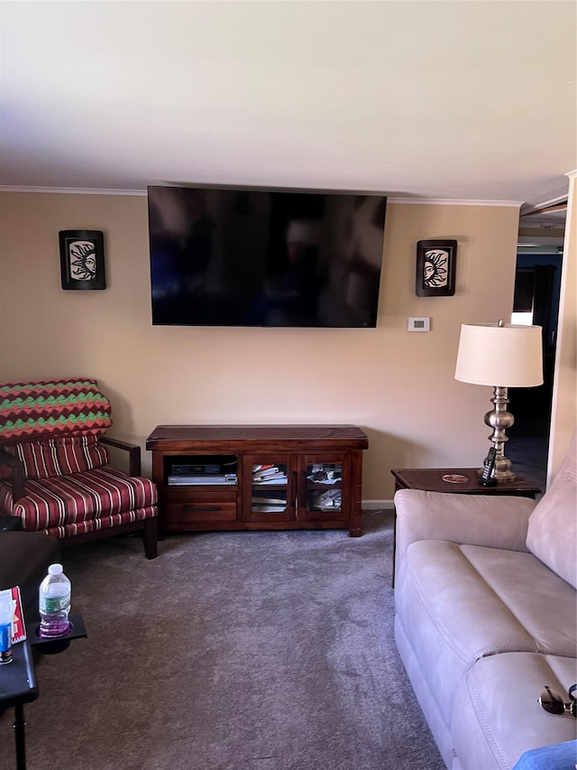 living area with ornamental molding and carpet
