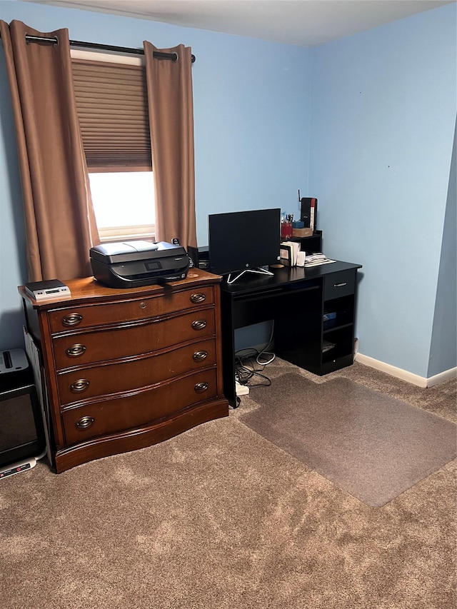 carpeted office space with baseboards