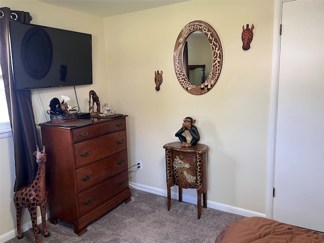 carpeted bedroom featuring baseboards
