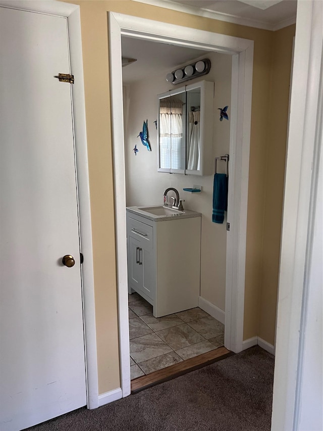 interior space with baseboards and vanity
