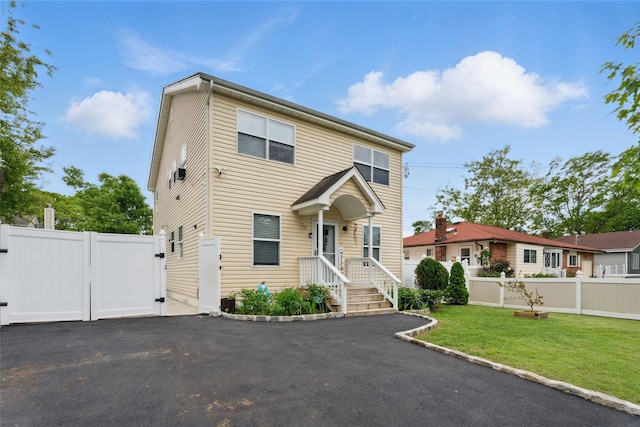 50 Darerka St, Amityville, NY 11701 - traditional-style house featuring a gate