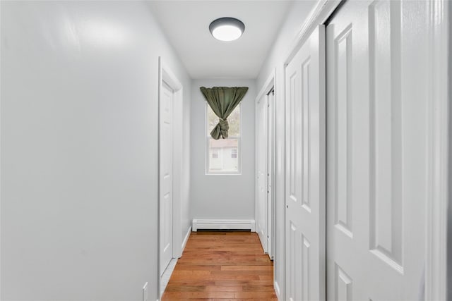 50 Darerka St, Amityville, NY 11701 - hall featuring a baseboard radiator and light wood-style flooring