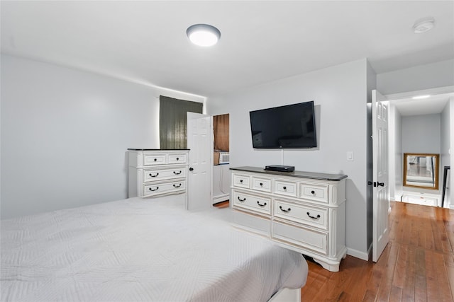 50 Darerka St, Amityville, NY 11701 - bedroom with hardwood / wood-style floors and baseboards