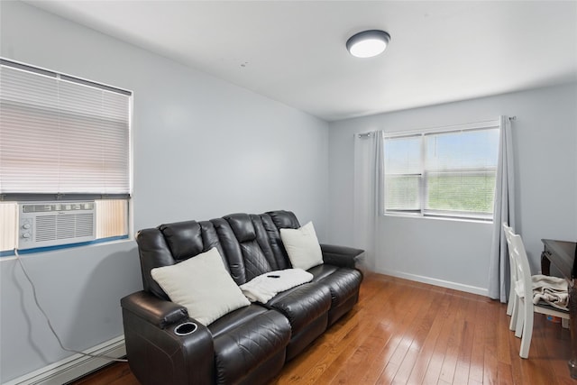 50 Darerka St, Amityville, NY 11701 - sitting room featuring a baseboard radiator, hardwood / wood-style flooring, cooling unit, and baseboards