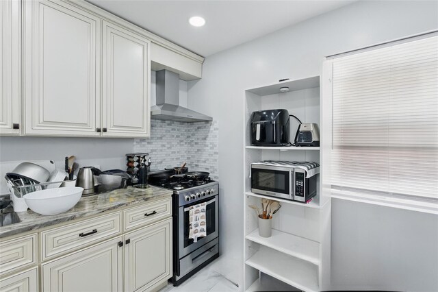 50 Darerka St, Amityville, NY 11701 - kitchen featuring wall chimney exhaust hood, stainless steel appliances, light marble finish flooring, tasteful backsplash, and light stone countertops