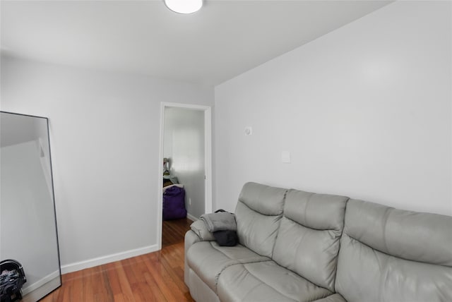 50 Darerka St, Amityville, NY 11701 - living room with baseboards and wood finished floors