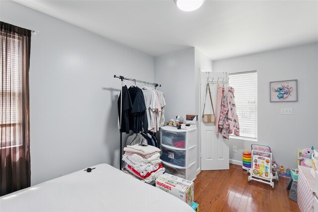 50 Darerka St, Amityville, NY 11701 - bedroom with hardwood / wood-style flooring and baseboards