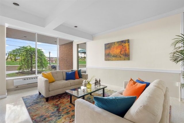 living area featuring baseboards, ornamental molding, and radiator heating unit