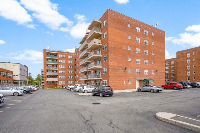 view of property featuring uncovered parking