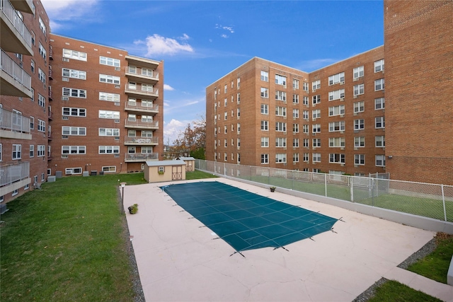 view of pool featuring fence