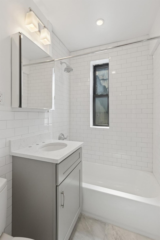90 Park Ter E Unit 3G, New York Manhattan, NY 10034 - bathroom featuring vanity, marble finish floor, shower / bathtub combination, toilet, and tile walls