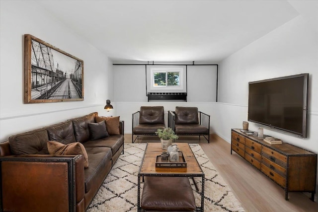 living room featuring baseboards and wood finished floors