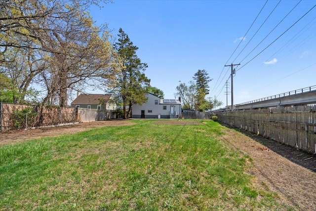 view of yard with a fenced backyard
