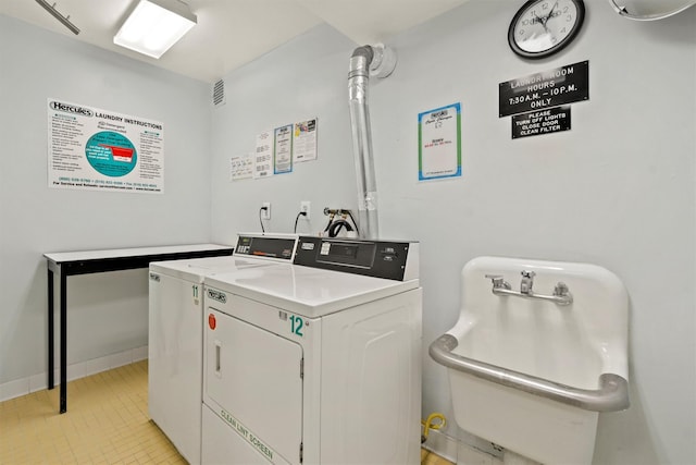 377 Westchester Ave Unit 6C, Port Chester, NY 10573 - communal laundry room featuring washing machine and dryer and baseboards