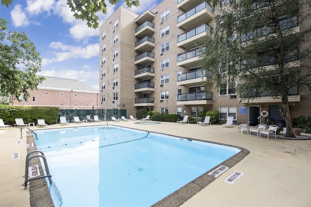 377 Westchester Ave Unit 6C, Port Chester, NY 10573 - community pool featuring a patio
