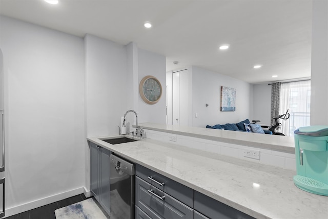 377 Westchester Ave Unit 6C, Port Chester, NY 10573 - kitchen featuring stainless steel dishwasher, a sink, gray cabinets, recessed lighting, and light stone counters