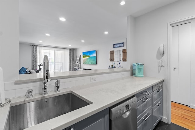 377 Westchester Ave Unit 6C, Port Chester, NY 10573 - kitchen featuring a sink, dishwasher, gray cabinetry, recessed lighting, and light stone countertops