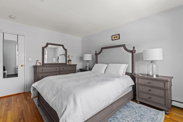 377 Westchester Ave Unit 6C, Port Chester, NY 10573 - bedroom with wood finished floors and baseboards