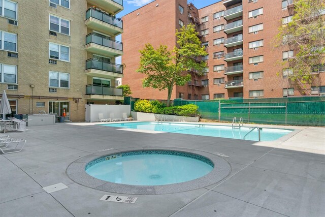 377 Westchester Ave Unit 6C, Port Chester, NY 10573 - community pool with a community hot tub and a patio