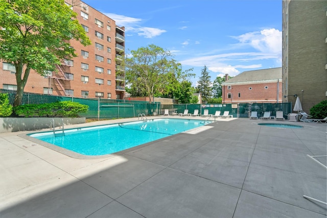 377 Westchester Ave Unit 6C, Port Chester, NY 10573 - community pool featuring a patio area and a hot tub