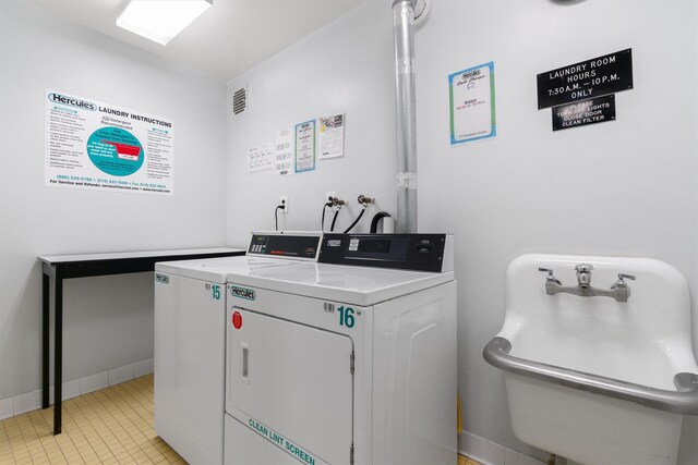 377 Westchester Ave Unit 6C, Port Chester, NY 10573 - community laundry with washing machine and clothes dryer and light tile patterned floors