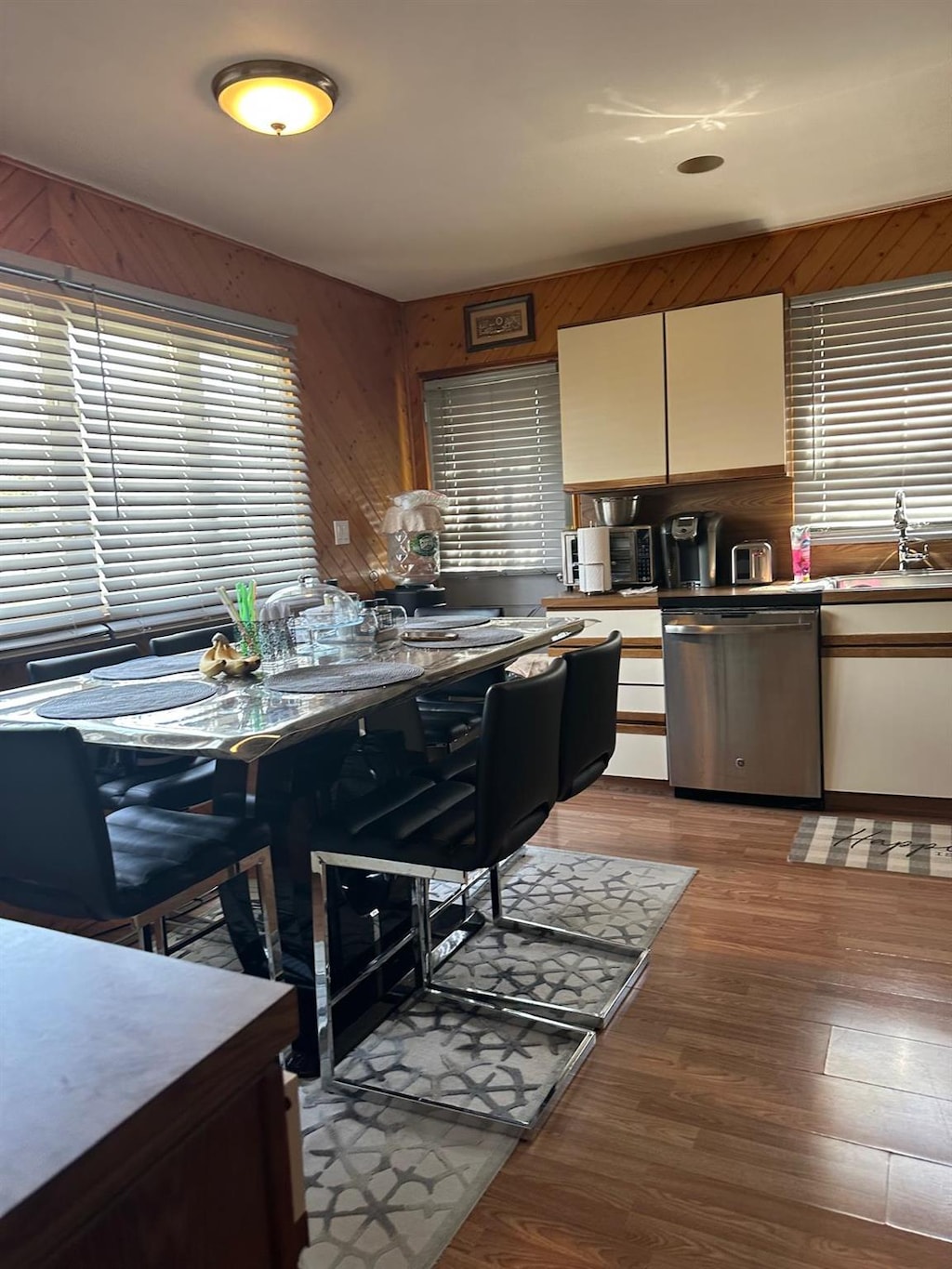 28 Glenda Dr, Deer Park, NY 11729 - kitchen with dishwasher, light wood-style floors, white cabinetry, and a sink