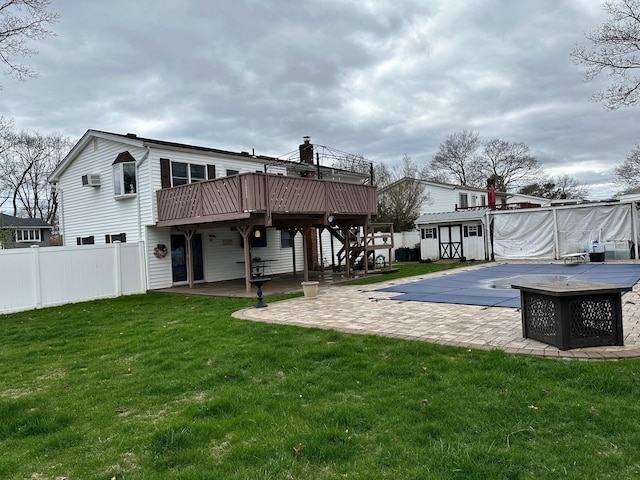 33 41st St, Islip, NY 11751 - rear view of house featuring a wooden deck, fence, a patio, and a yard