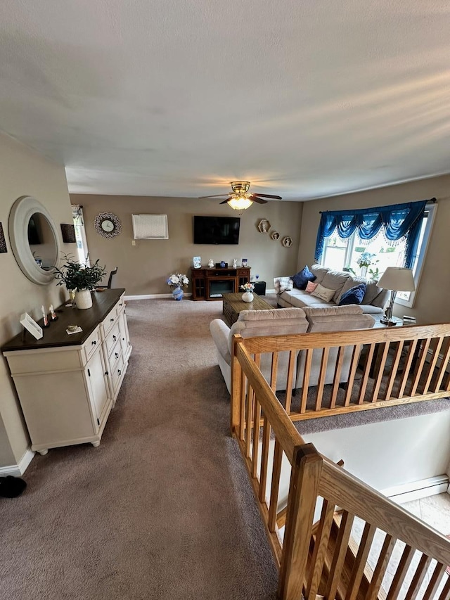33 41st St, Islip, NY 11751 - living area featuring dark carpet, baseboards, and ceiling fan