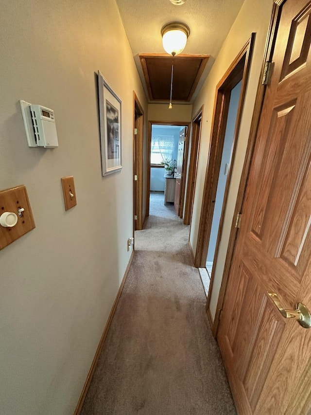 33 41st St, Islip, NY 11751 - corridor with carpet floors, attic access, and baseboards