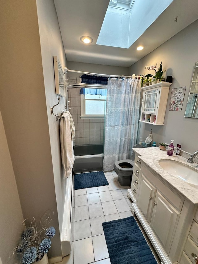 33 41st St, Islip, NY 11751 - full bath featuring tile patterned flooring, vanity, toilet, shower / bathtub combination with curtain, and a skylight