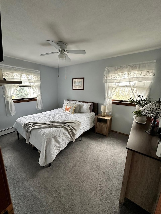 33 41st St, Islip, NY 11751 - carpeted bedroom with ceiling fan and baseboard heating