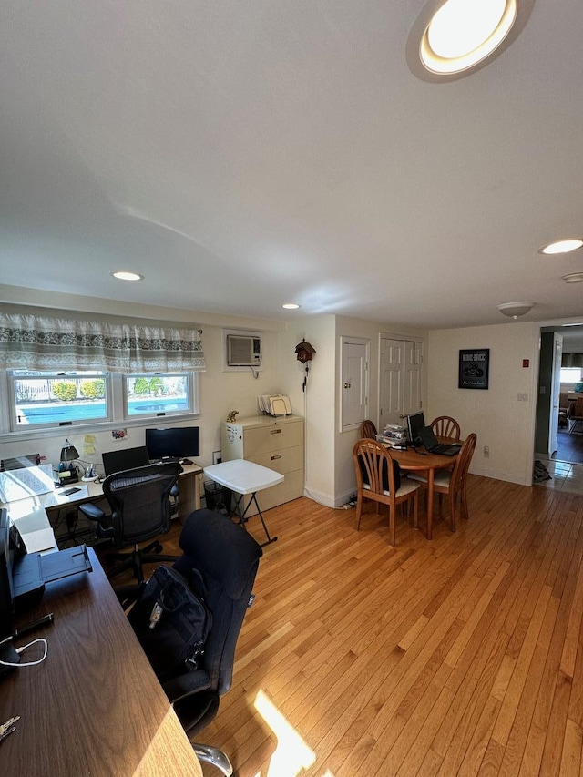 33 41st St, Islip, NY 11751 - office area featuring a wall unit AC and light wood-style flooring