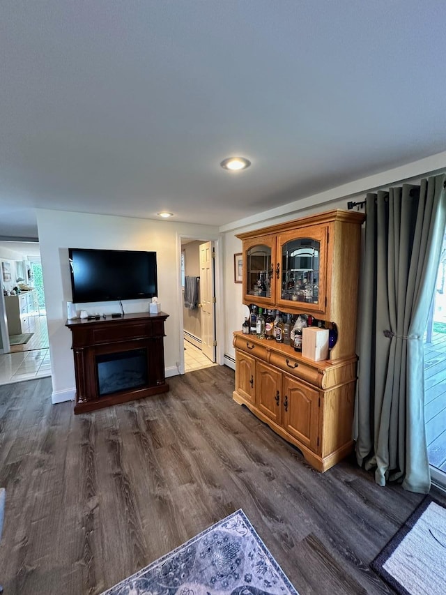 33 41st St, Islip, NY 11751 - living area featuring dark wood-style flooring, recessed lighting, and a fireplace
