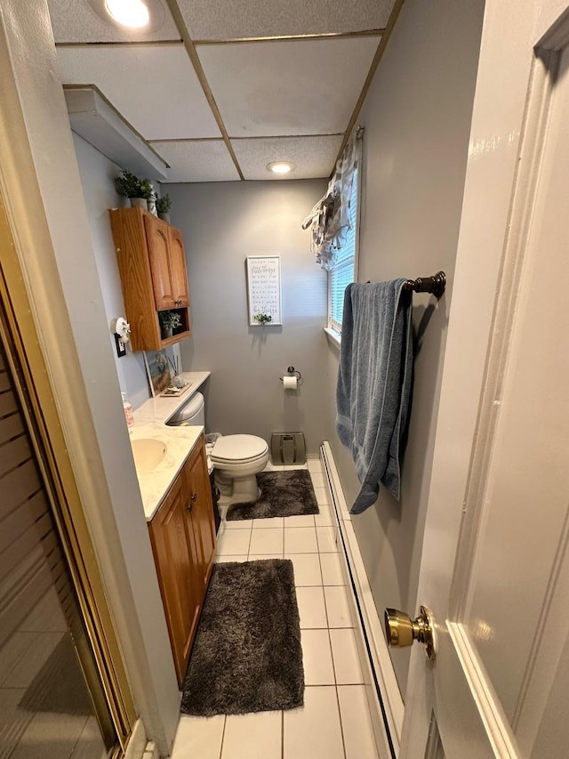 33 41st St, Islip, NY 11751 - bathroom featuring a paneled ceiling, tile patterned floors, vanity, toilet, and recessed lighting