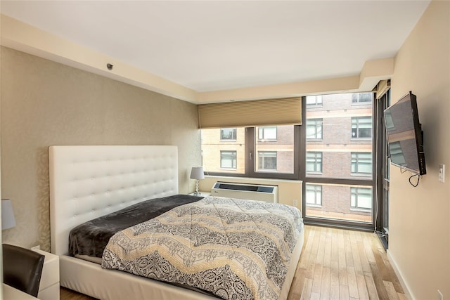 bedroom with wood-type flooring