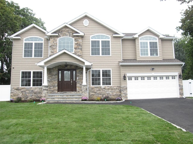 267 N Elm St, Massapequa, NY 11758 - craftsman inspired home with stone siding, driveway, and a garage