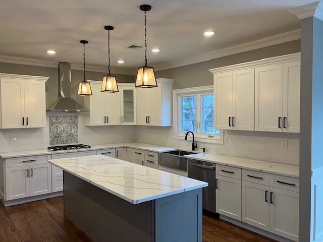 267 N Elm St, Massapequa, NY 11758 - kitchen with wall chimney range hood, stainless steel dishwasher, a sink, white cabinets, and a kitchen island