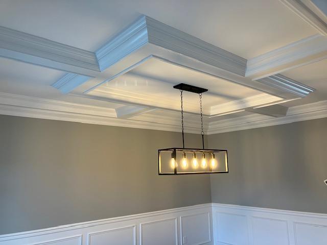 267 N Elm St, Massapequa, NY 11758 - detailed view of coffered ceiling, ornamental molding, a decorative wall, beam ceiling, and a chandelier