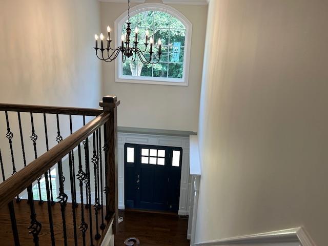 267 N Elm St, Massapequa, NY 11758 - foyer with a chandelier and dark wood finished floors