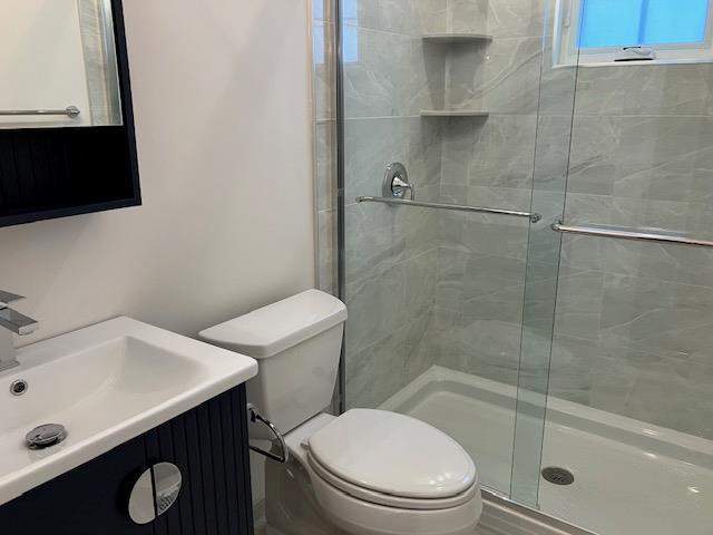 267 N Elm St, Massapequa, NY 11758 - full bath featuring a shower stall, toilet, and vanity