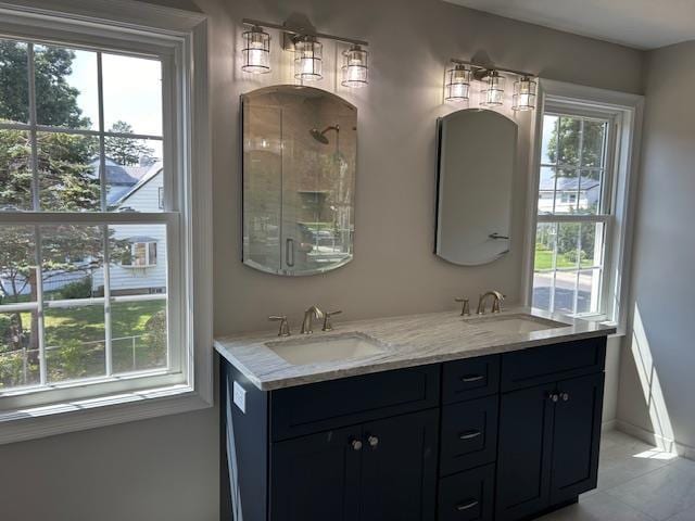 267 N Elm St, Massapequa, NY 11758 - full bath featuring double vanity, an enclosed shower, and baseboards