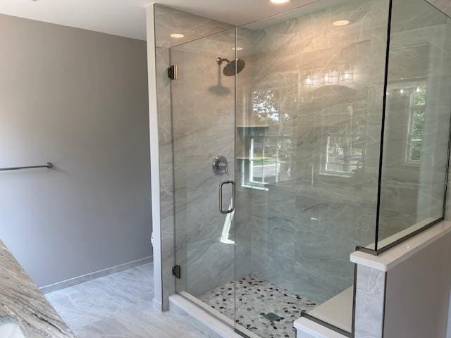 267 N Elm St, Massapequa, NY 11758 - bathroom with a stall shower, marble finish floors, and recessed lighting