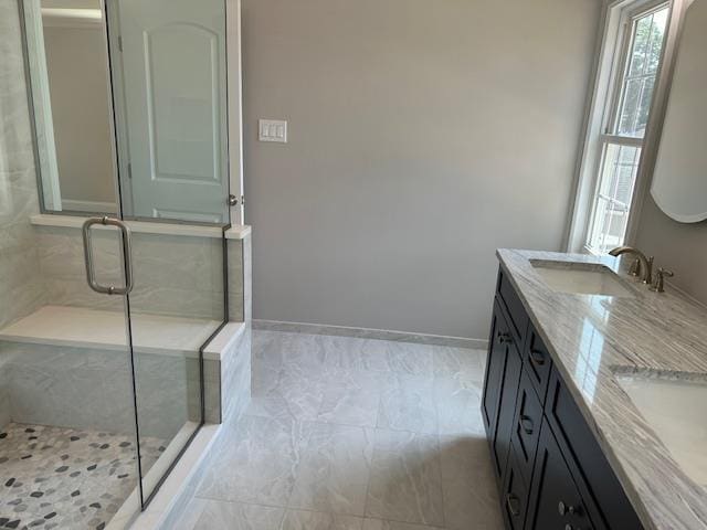 267 N Elm St, Massapequa, NY 11758 - full bath featuring double vanity, a shower stall, and baseboards