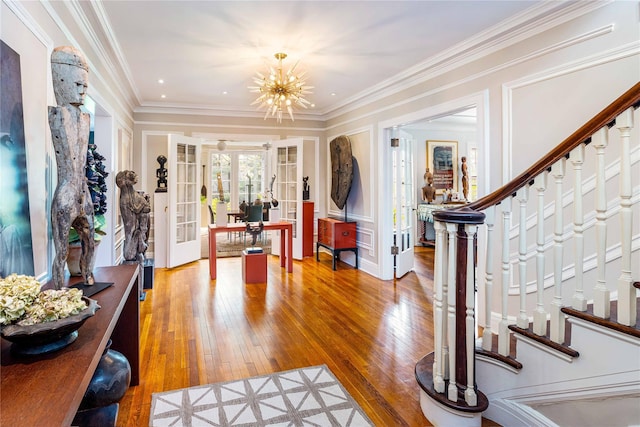 157 Alta Ave, Yonkers, NY 10705 - entrance foyer with french doors, an inviting chandelier, stairs, crown molding, and hardwood / wood-style flooring