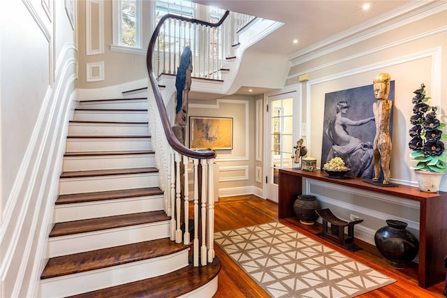 157 Alta Ave, Yonkers, NY 10705 - stairway featuring a decorative wall, crown molding, and wood finished floors