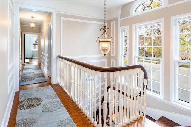 157 Alta Ave, Yonkers, NY 10705 - hallway with a wealth of natural light, a decorative wall, and wood finished floors