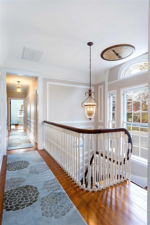 157 Alta Ave, Yonkers, NY 10705 - hall with a decorative wall, visible vents, and wood finished floors