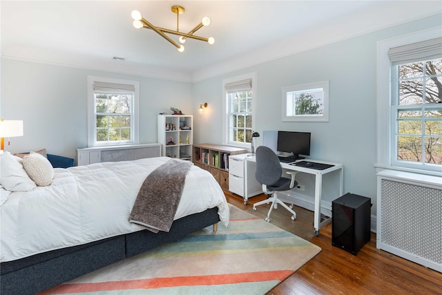 157 Alta Ave, Yonkers, NY 10705 - bedroom with an inviting chandelier, wood finished floors, multiple windows, and radiator heating unit
