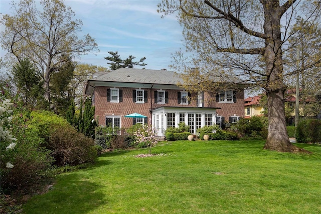 157 Alta Ave, Yonkers, NY 10705 - back of property with a lawn and brick siding