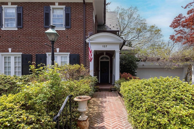 157 Alta Ave, Yonkers, NY 10705 - doorway to property with a garage and brick siding
